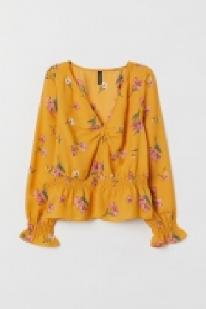 Blouse avec détail noué 8.99 €