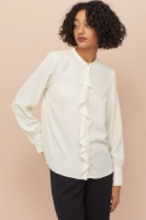  Blouse volantée 18.99 €