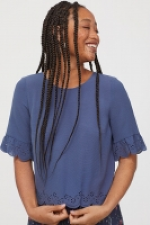  Top à bord festonné 9.99 €