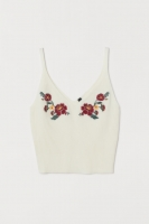  Top côtelé avec broderies 6.99 €