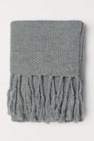 Plaid en maille avec franges 29.99 €