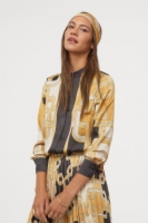  Blouse en satin à motif 17.99 €