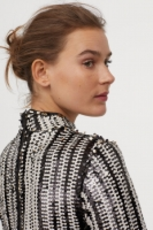  Top à paillettes 29.99 €