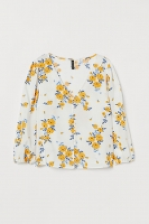  Blouse à encolure en V 10.99 €
