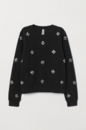 Sweat avec applications 16.99 €