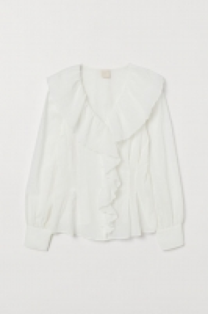 Blouse volantée 23.99 €