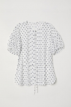 Blouse à manches bouffantes 19.99 €