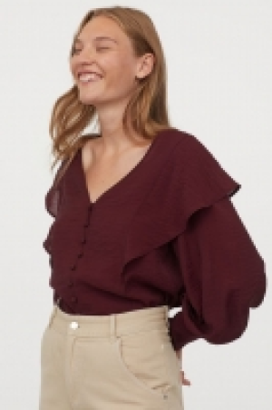 Blouse à volants 11.99 €