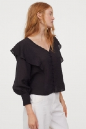 Blouse à volants 10.99 €