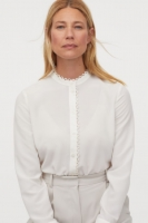 Blouse à bords festonnés 15.99 €