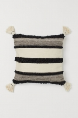 Housse de coussin à pompons 13.99 €