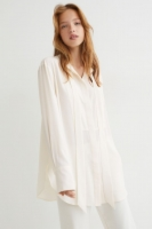 HM  Blouse longue avec col à nouer