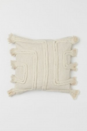 HM  Housse de coussin à pompons